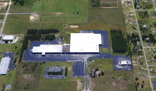 Modern healthcare facility at Bayview PACE with large parking and surrounding green space.