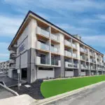 Modern Bayview PACE senior apartment complex in a vibrant community setting.