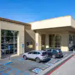 Accessible parking spaces at Bayview PACE facility for seniors and disabled individuals.