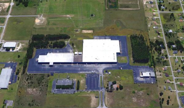 Modern healthcare facility at Bayview PACE with large parking and surrounding green space.