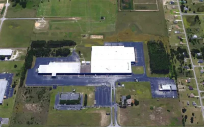 Modern healthcare facility at Bayview PACE with large parking and surrounding green space.