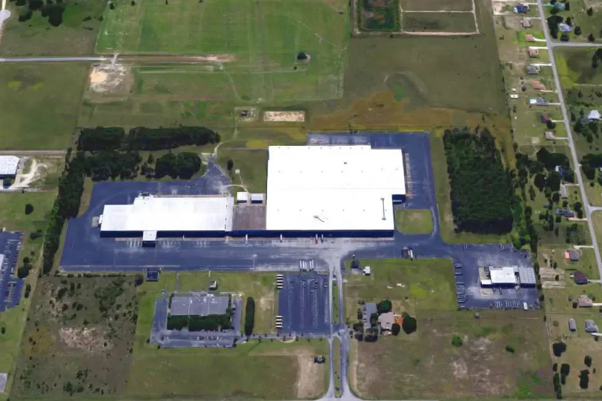 Modern healthcare facility at Bayview PACE with large parking and surrounding green space.