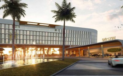 Modern luxury Westin hotel with palm trees and water fountain, sunset lighting, appealing for travelers.